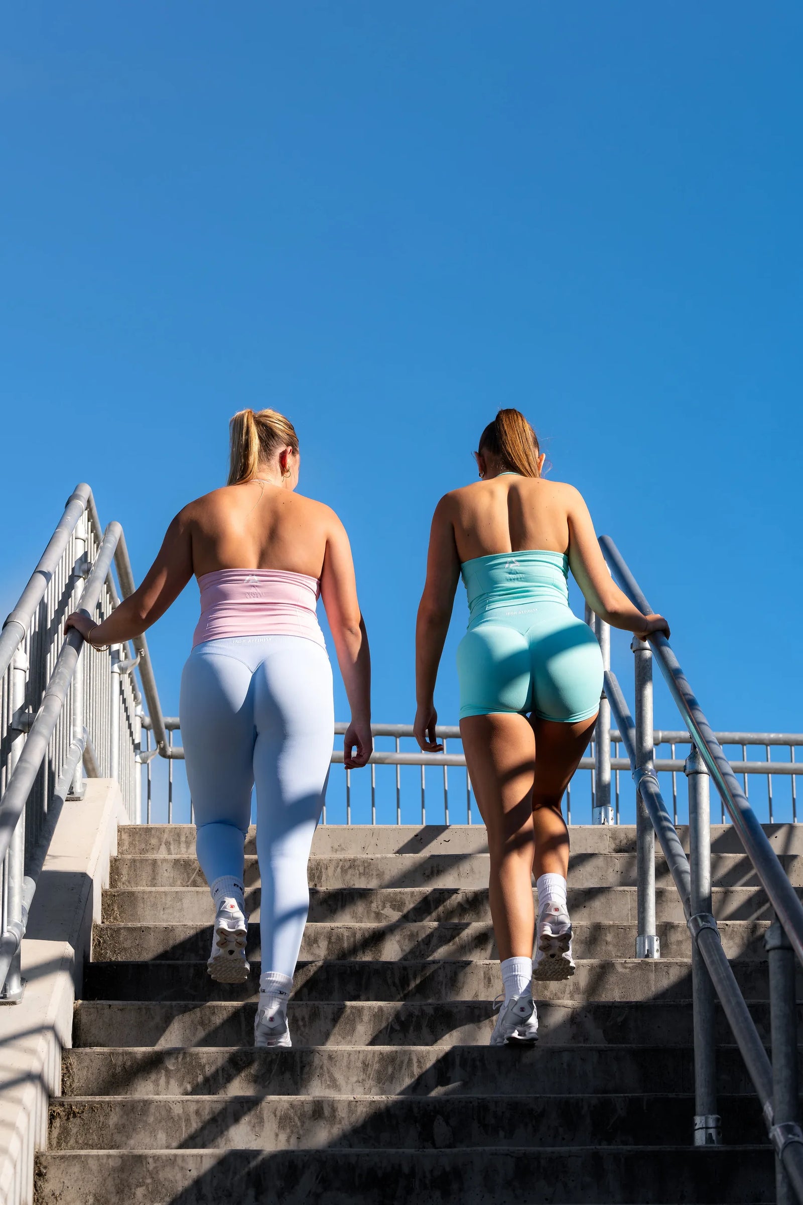 Iron Affinity Flow halter tanks styled with training apparel outdoors